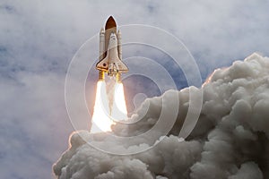 The launch of the space shuttle against the sky, fire and smoke. Elements of this image were furnished by NASA