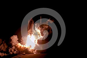 The launch of the space shuttle against the sky, fire and smoke. Elements of this image were furnished by NASA