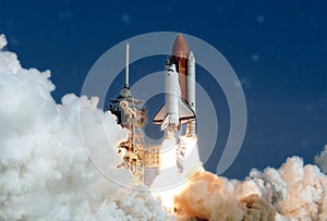 The launch of the space shuttle. With fire and smoke.  Elements of this image were furnished by NASA