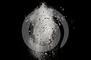 Launched white powder white small stones splash on black background. photo
