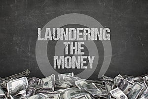 Laundering the money text on black background