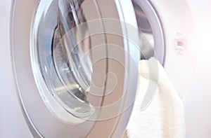 Laundry background. Door of launder machine. photo