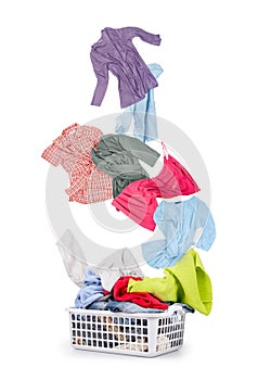 Laundry in a basket and falling clothes