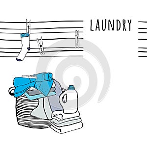 Laundry basket and folded sheets, clothespins, towels and detergent.