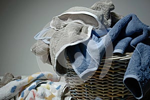 laundry basket overflowing with soiled towels