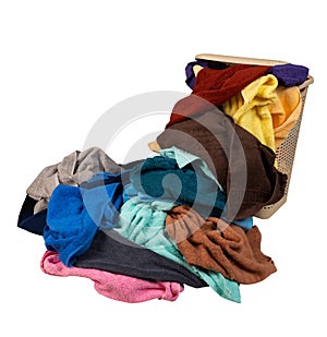 Laundry basket with a pile of towels isolated on white background