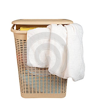 Laundry basket with a towels isolated on white background