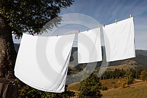 Laundry with clothes pins on line outdoors