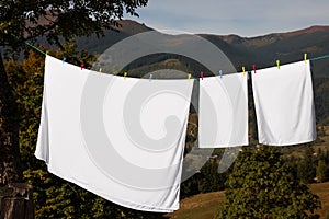 Laundry with clothes pins on line outdoors