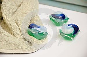 Laundry detergent. laundry pods at towel. household and laundry