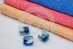 Laundry detergent pods for washing machine and colorful bath towels