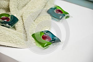 Laundry detergent. towel and laundry pods isolated on white. household and laundry