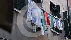 Laundry Dries on a Line Outside an Old Building on Venice Street, Italy