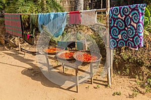 Laundry and drying chilli peppers in Donkhoun (Done Khoun) village near Nong Khiaw, La