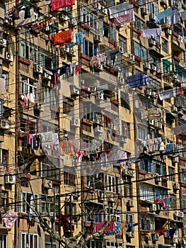 Laundry drying at windows of Chinese residential building