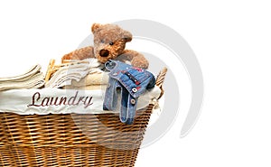 Laundry full of towels with teddy bear