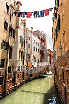 Laundry hanging out to dry on ropes over canal, Venice, Italy