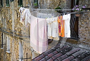 Laundry hanging out of a typical Italian facade.