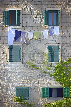 Laundry hanging on a rope,  on open windows