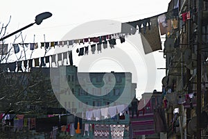 Laundry hangs in front of the windows of the facade in Ba