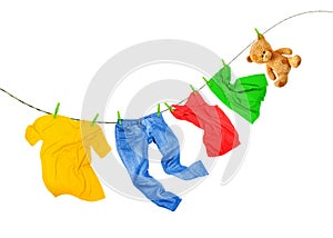 Laundry line with colored clothes isolated on a white background