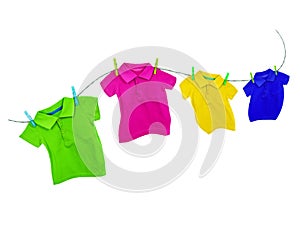Laundry line with colored t-shirts on a white background