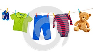 Laundry line with colorful clothes on a white background
