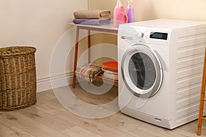 Laundry room interior with washing machine