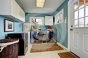 Laundry room with modern steel appliances