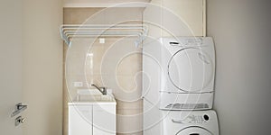 Laundry room with modern washer and dryer