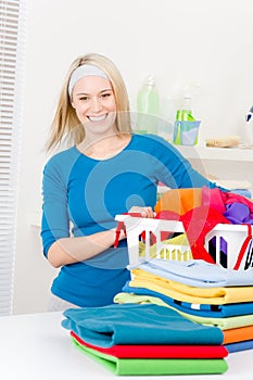 Laundry - woman folding clothes home