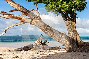 Laura beach. Azure blue turquoise lagoon. Majuro atoll, Marshall islands, Micronesia, Oceania. Woman tourist makes a photo.