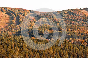 Laurentian mountains, Quebec, Canada during the fall foliage season surrounded by the red, orange and yellow trees