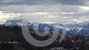 Lausanne Switzerland, cityscape and snowy alps