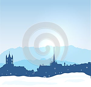 Lausanne winter skyline with mountains and snow.