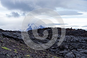 Lava on the background of the Ostry Tolbachik volcano in Kamchatka