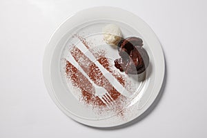 Lava cake with ice cream on a white plate.