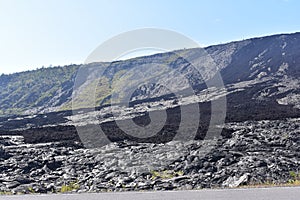 Lava fields on the Big Island in Hawaii with the Pacific Ocean in the background