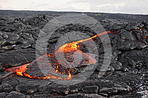 Lava flows out of a fissure