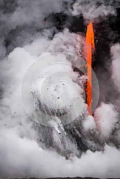 Lava pours into the sea causing explosions and debris flying