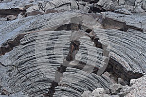 Lava Rocks Next To Erupting Volcano.