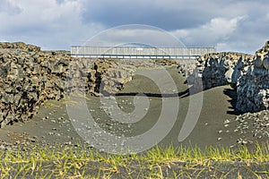 Lava rocks on Reykjanes peninsula with bridge