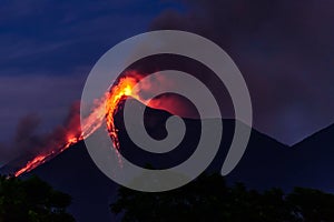 Lava spurts from erupting Fuego volcano in Guatemala photo