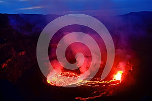 Lava and steam in crater of Nyiragongo volcano in Virunga Nation photo