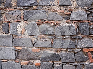 Lava stone texture. Brick texture. Porous black volcanic rock