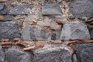 Lava stone texture. Brick texture. Porous black volcanic rock