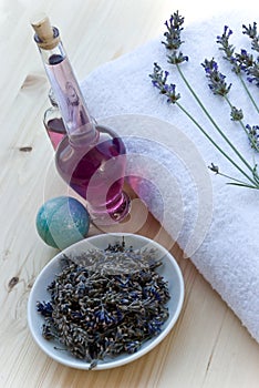 Lavander branch on the towel with lavender oil bo