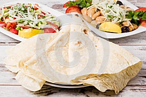 Lavas, Traditional Turkish Flat Bread and Salad on White Wooden