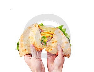 Lavash with melted cheese in hands