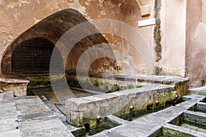 Lavatoio Medievale Fiume Cefalino, a Medieval wash house in the old town of Cefalu, Sicily, Italy photo